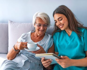 Young,Nurse,Spending,Time,With,Happy,Elder,Patient,In,Nursing